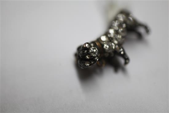 A small Victorian gold and silver, rose cut diamond and cabochon ruby set pug dog brooch, 0.75in.